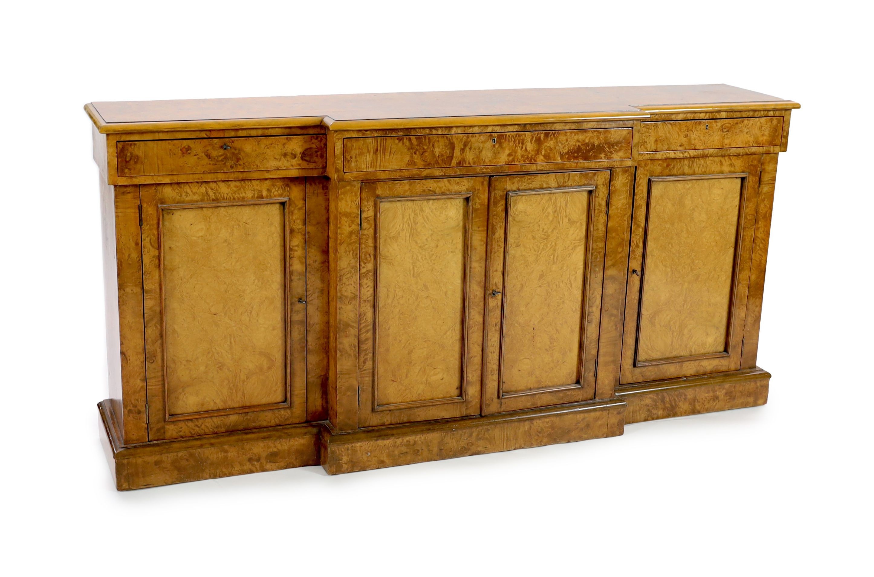 A Victorian walnut breakfront dwarf bookcase, W.195cm D.44cm H.95cm